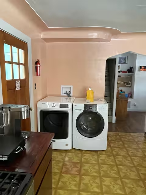 Laundry area with washer and dryer inside Yooper Lodge