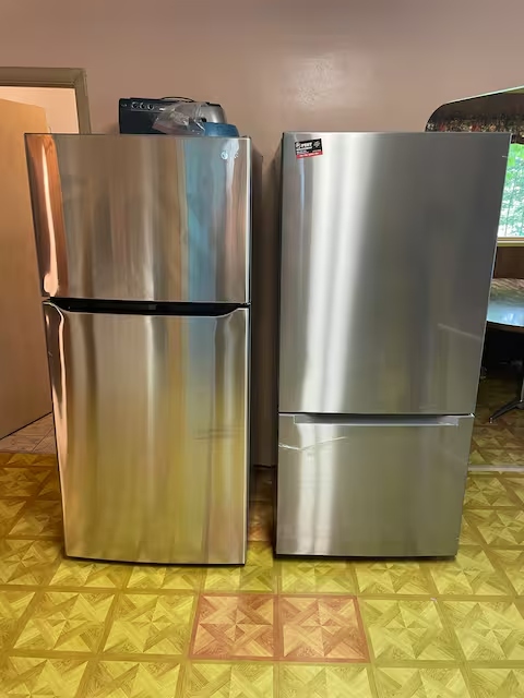 Two large stainless steel refrigerators in the Yooper Lodge kitchen